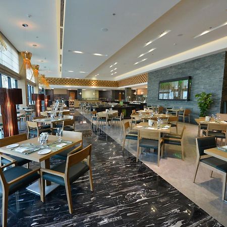 מנאמה Ramee Grand Hotel And Spa מראה חיצוני תמונה The restaurant
